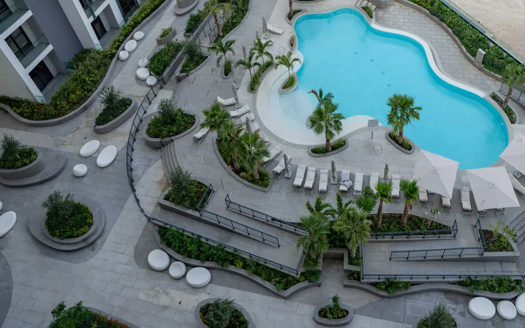 Jannat at Midtown completed pool courtyard in Dubai Production City, official developer photograph. Area context, not a photograph of Sera Gardens by Vision.