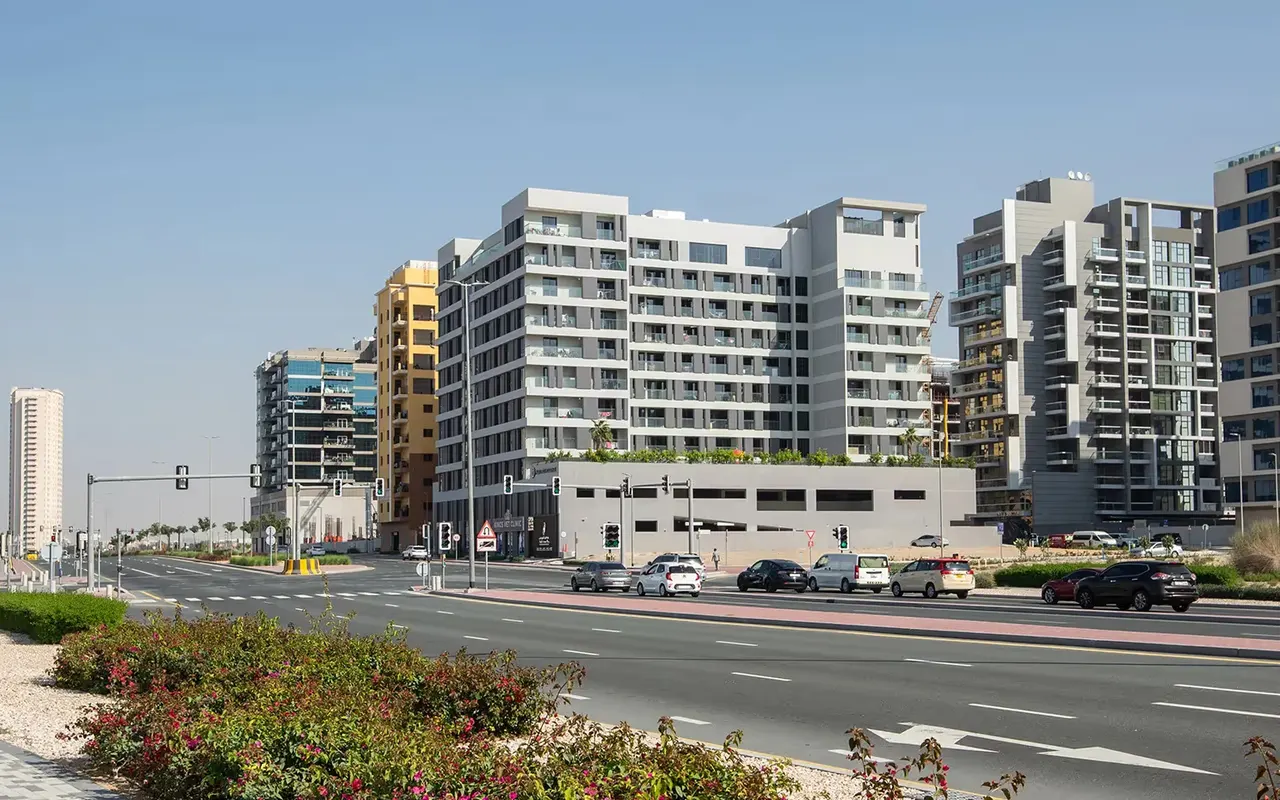 Majan residential buildings and local streets, official developer photograph. Area context, not a photograph of Al Rabia Tower.