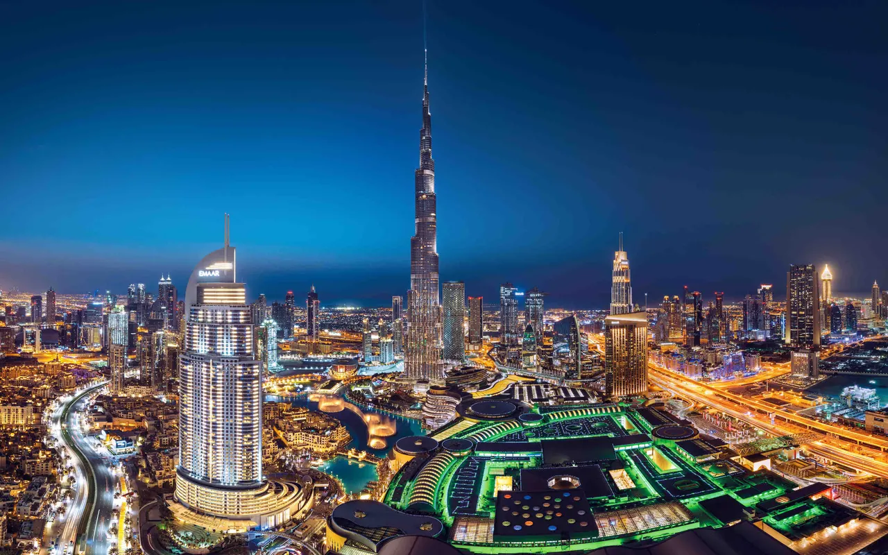 Burj Khalifa, Dubai Fountain and the illuminated Downtown Dubai skyline. Area context, not a photograph of Blvd Crescent Tower 1.