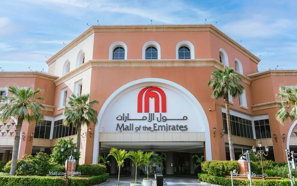 Mall of the Emirates entrance facade and palms in Al Barsha First. Area context, not a photograph of Al Murad Towers.