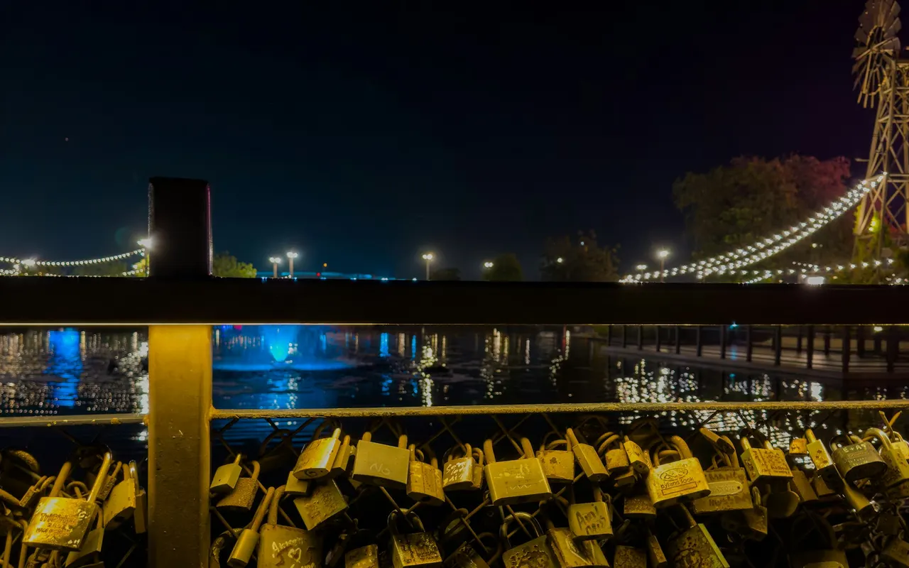 Promise bridge with padlocks and lights at Last Exit Al Khawaneej
