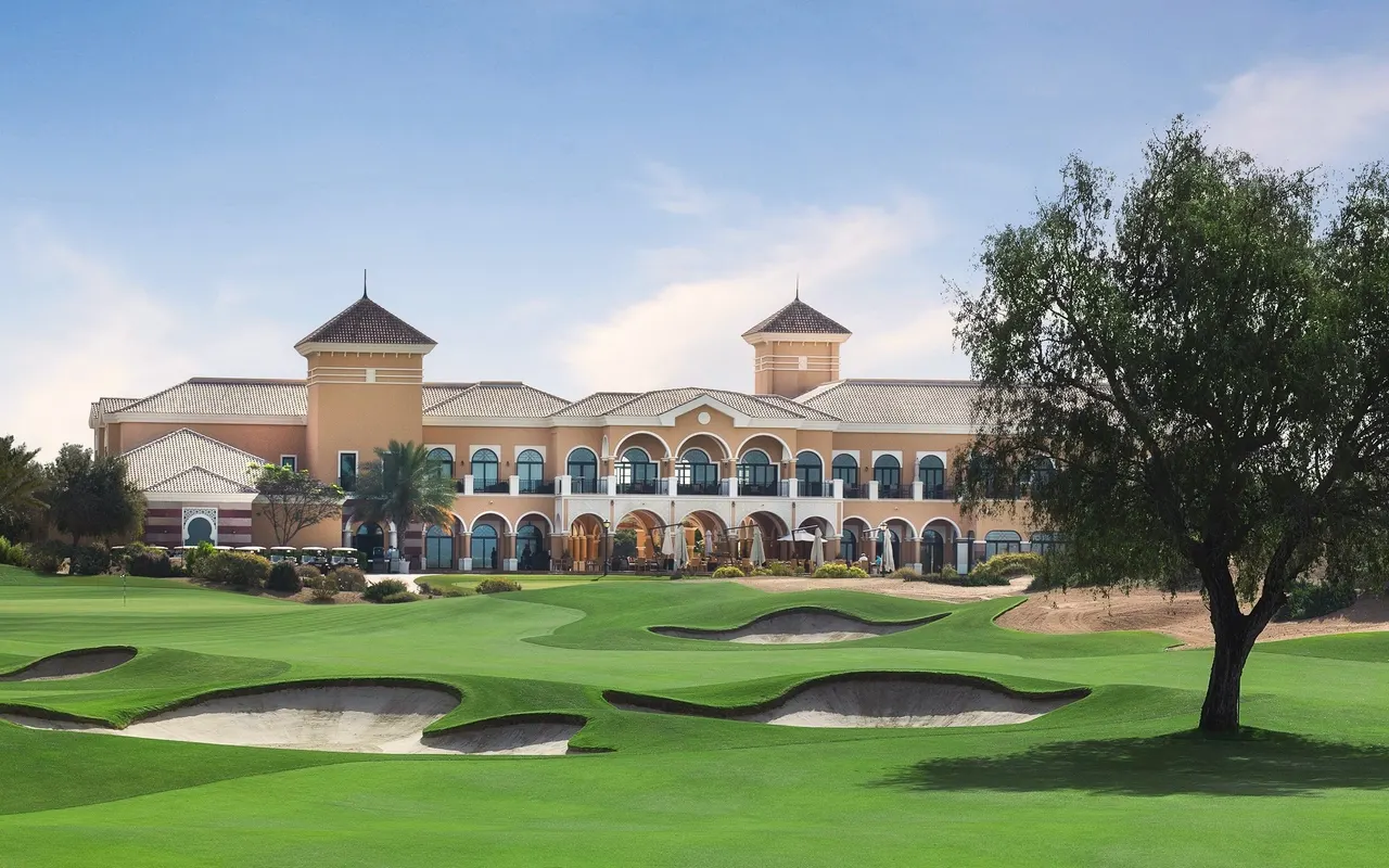 The Els Club clubhouse and ninth-hole fairway in Dubai Sports City